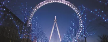 London Eye at night lit up white