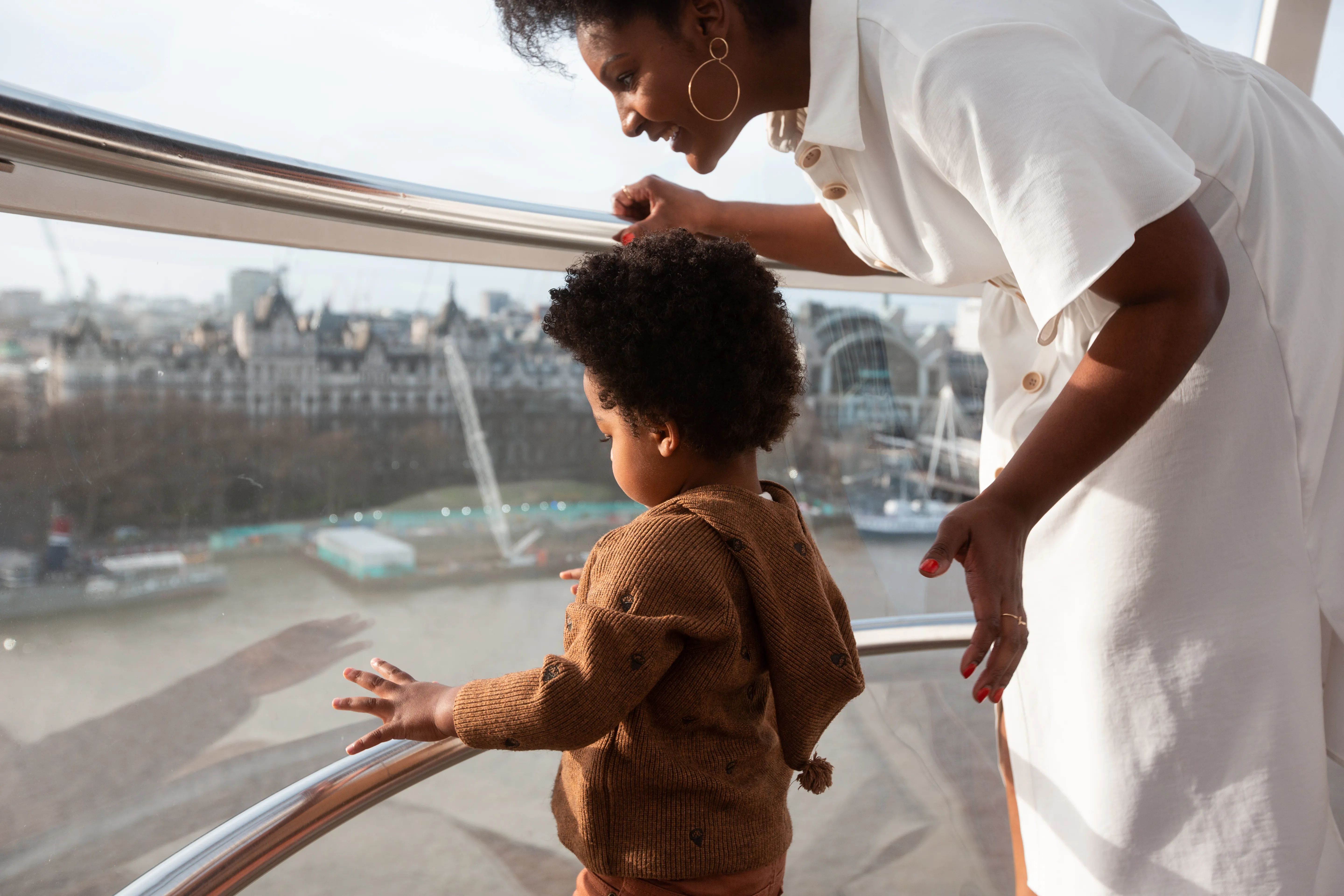 Mum And Son Looking Out Of Pod