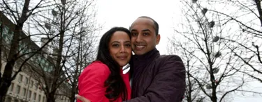 Couple engaged in front of London Eye