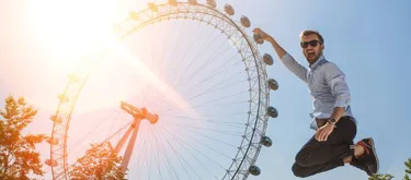 Man jumping in front of London Eye