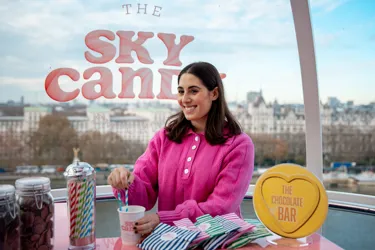Woman stirring drink on the London Eye 