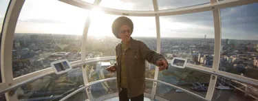 Man on london eye at sunset