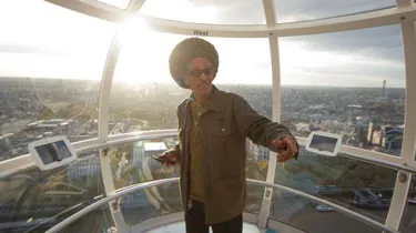 Man on london eye at sunset