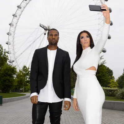 Kim Kardashian and Kanye West wax figure in front of London Eye