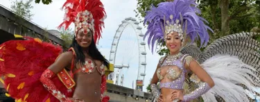 Two dancers in front of London Eye