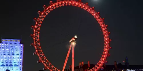 London Eye lit up red at night