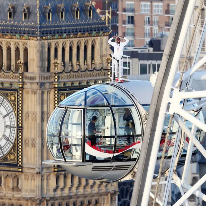 Mo Farah standing on London Eye pod